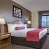 Fiesta Rancho Hotel And Casino Las Vegas guest room with king bed and mountain view through window