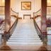 British Colonial Nassau in Nassau lobby with grand white staircase and symmetrical railings