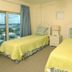 Crystal Towers Gulf Shores bedroom with two twin beds and balcony ocean view