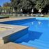 Estalagem Vianorte in Matosinhos with a blue outdoor pool, steps, loungers and umbrellas
