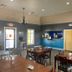 Kenedy Inn and Suites in Kenedy breakfast area with tables, coffee station, and seating