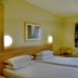 Road Lodge Bloemfontein Airport room with two single beds, window, desk and chair in Bloemfontein