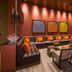Hampton by Hilton Bogota Usaquen lounge seating area in Bogotá with sectional sofas, armchairs and wall art