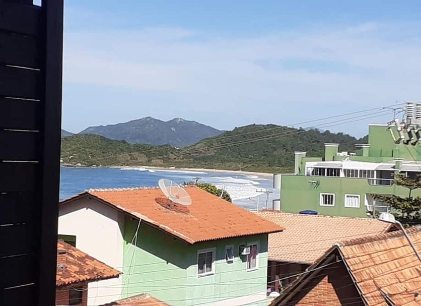 Pousada Retiro das Ilhas in Bombinhas with ocean view, sandy beach, and hillside backdrop