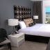 Lotus Boutique Inn & Suites, Ormond Beach room with ocean-view balcony and king bed