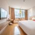 Shanshui Trends Hotel (Universiade Sports Center) Chengdu guest room with large bed, window seating and city view