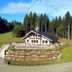 Gut Lauterbad Hotel in Freudenstadt, hillside lodge surrounded by forest and grassy grounds