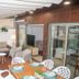 Casas e Quintas de Praia in Aveiro: covered terrace with sofa, chairs, dining table and TV