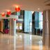 Orchardz Hotel Industri in Jakarta lobby with red lantern-style lights and polished floors