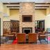Four Points by Sheraton Buffalo Grove lobby with stone fireplace, seating area, and lounge chairs