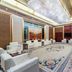 Liuhu Hotel (Hot Spring Garden Hotel) in Dezhou lobby lounge with white sofas and floral carpet