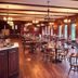 Cumberland Falls State Resort Park dining room in Corbin with wooden tables, chairs, and large windows