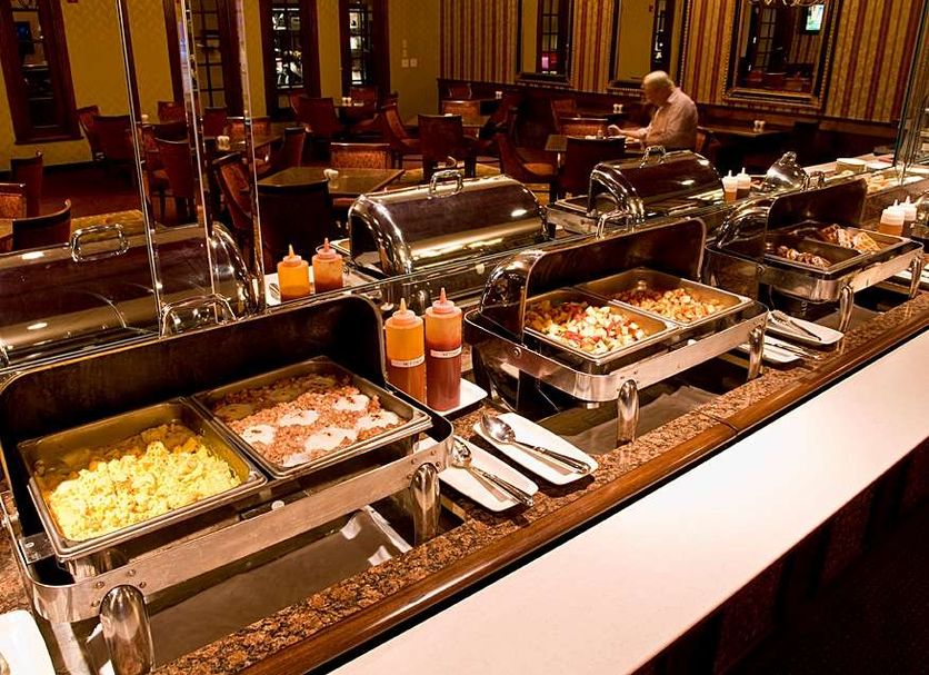 Salvatores Grand Hotel Williamsville breakfast buffet with hot food trays and dining room