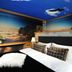 Hotel Fire & Ice Düsseldorf/Neuss room with sky mural walls and ceiling over a bed in Neuss