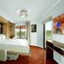 Disney's Riviera Resort room with pull-down bed, balcony doors and resort views in Lake Buena Vista