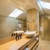 Familienhotel Mateera Gargellen bathroom with skylights, dual sinks, mirrors and towel warmers in Gargellen
