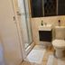 The Royal Princess Garden - Randburg bathroom with shower, sink vanity and toilet