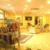Hotel Orizzonte in Letojanni lobby lounge with seating area, reception desk and warm lighting