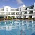 Club del Carmen in Tías with a large outdoor pool and white apartment-style balconies