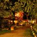 Hospedium Hacienda Las Cavas in Olmedo at night, with lit garden path and leafy trees