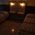 Hotel Blue Star II in Foz do Iguaçu: twin beds in a dimly lit guest room