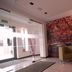 La Petite Apartments & Rooms, Gdansk lobby with seating, glass entry and autumn mural