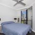 Surfers Plaza Resort, Surfers Paradise bedroom with queen bed and balcony view of high-rise buildings