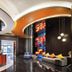 Hampton By Hilton Beijing Wangjing lobby with colorful seating and curved ceiling in Beijing