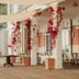 Hotel Del Golfo in Finale Ligure terrace with red flowering vines, white columns and café tables