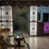 Hotel Ajay International, Agra lobby with lit patterned panels, reception desk, and seating area