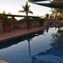 Hospitality Port Hedland pool deck with shaded outdoor swimming pool at sunset in Port Hedland
