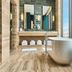 The Hollywood Grande, Autograph Collection bathroom with soaking tub and city view in Los Angeles