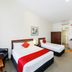 Fitzherbert Regency Motor Lodge room in Palmerston North with two beds, desk and kitchenette