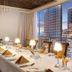 Golden Tulip Westlands Nairobi dining room with table set beside city skyline views in Nairobi