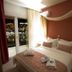 Panorama Junior Suites in Kavála bedroom with balcony doors and city lights view