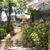 Hotel Rosa Del Tirreno in Quercianella, garden staircase with stone walls and flowering plants