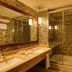 Gazelle Resort & Spa Karacasu bathroom with double sink vanity and glass-enclosed shower