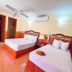 Maya Campeche Hotel in Campeche: twin bedroom with two beds, ceiling fan, mirror, and air conditioner