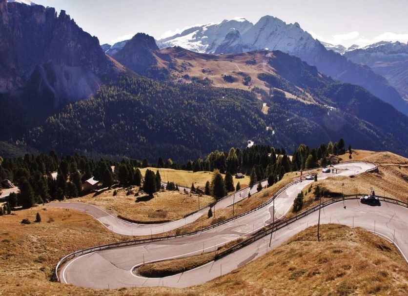 Mountain road view from Hotel Leitner, Rio di Pusteria, with alpine peaks and winding curves