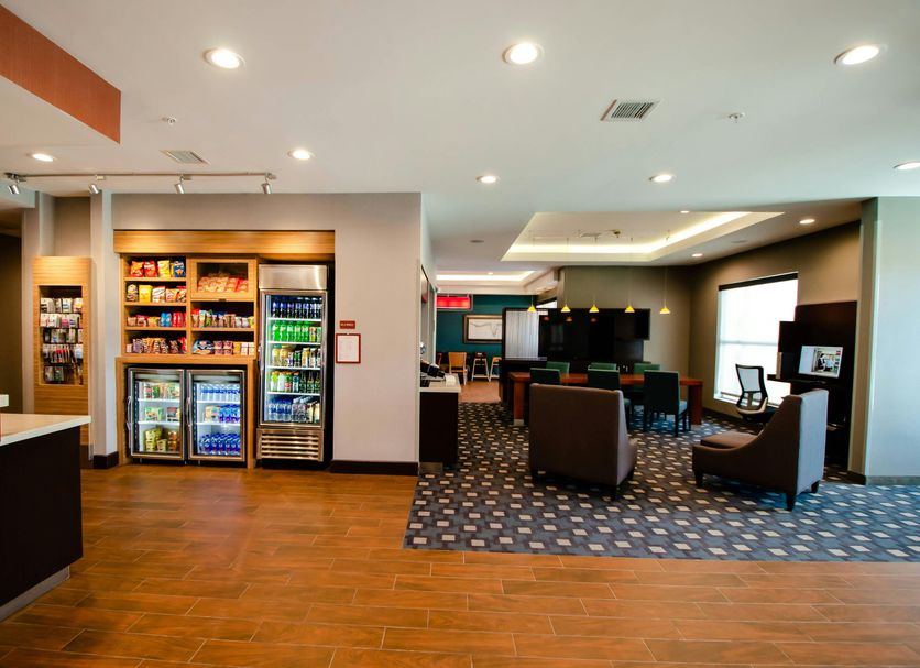 TownePlace Suites by Marriott Temple lobby with snack market, seating area, and wood-look flooring