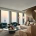 Rosewood Guangzhou suite with curved staircase, city skyline view and seating area in Guangzhou