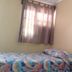 Hotel Flor de Itabo room in Coco with colorful bedspread, window with curtains, and bedside table