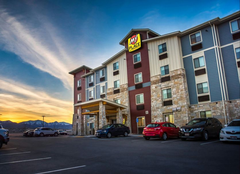 My Place Hotel-Salt Lake City/West Jordan exterior at sunset in West Jordan with parking lot and mountain view