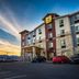 My Place Hotel-Salt Lake City/West Jordan exterior at sunset in West Jordan with parking lot and mountain view
