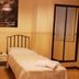 Grand Hotel Lamezia in Lamezia Terme: twin room with two single beds, bedside table, and mirror closet
