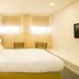 Bo - Álvares Cabral Guesthouse in Porto with a bright minimalist double bed and window seating area