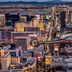 Holiday Inn Express & Suites Las Vegas Sw Springvalley by IHG with Las Vegas Strip and helicopter at dusk