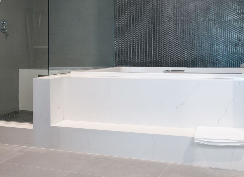 Tilbury Inn Glendale bathroom with glass shower and white soaking tub