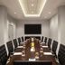 Sheraton Philadelphia University City Hotel boardroom with long conference table and wall-mounted screen