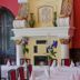 Palac Krobielowice dining room with white-clothed tables, red walls, and ornate fireplace in Kąty Wrocławskie